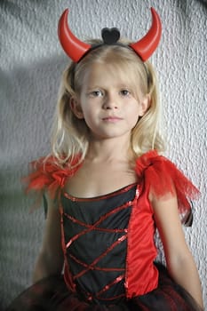 Little girl dressed as devil.








Little girl in Halloween costume.