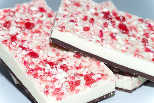 Close-up of candy cane topped white and dark chocolate bark.