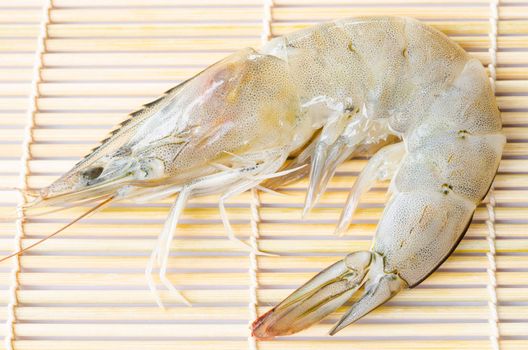 fresh shrimps on wooden background.