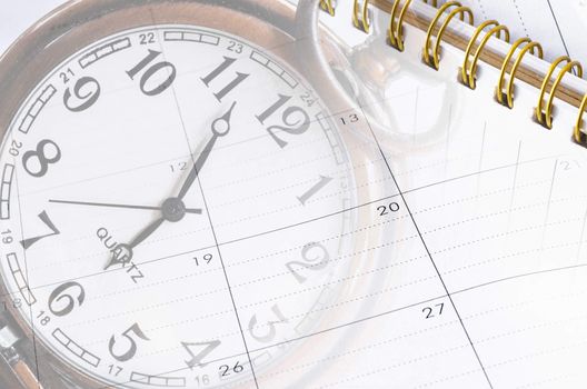 sheet of a calendar and diary with the number of days and clock close-up