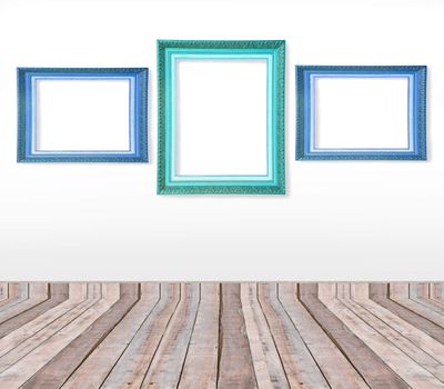 Set of blue vintage picture frames on the wall inside the room