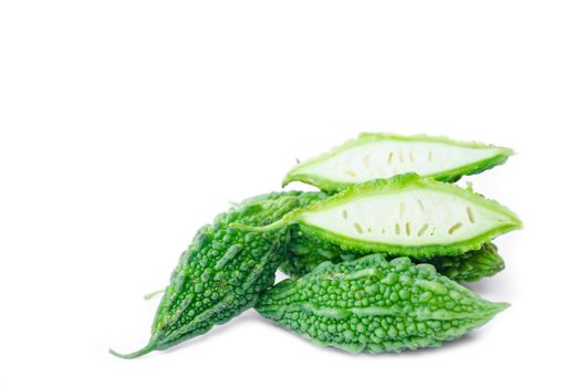 green herb (momordica charantia) over white background