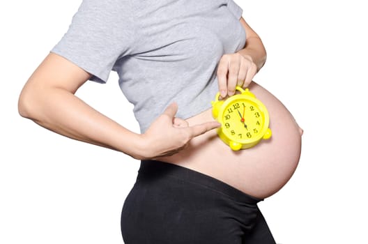 Pregnant woman's belly with clock. isolated on white background. clipping path.