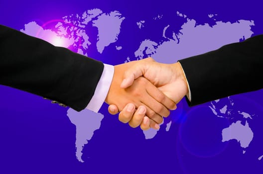Hand shake between a businessman and a businesswoman on world map.