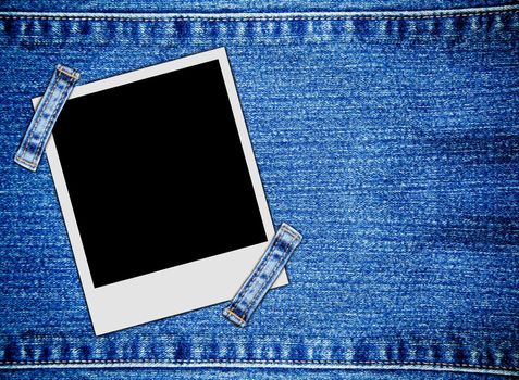 Blank instant photo frames on jeans background
