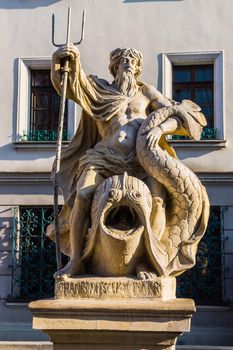 The fountain of Neptune on a dolphin in the Main Market in Gliwice, Silesia region, Poland. Sculpture created in 1794 by baroque sculptor Johannes Nitsche.