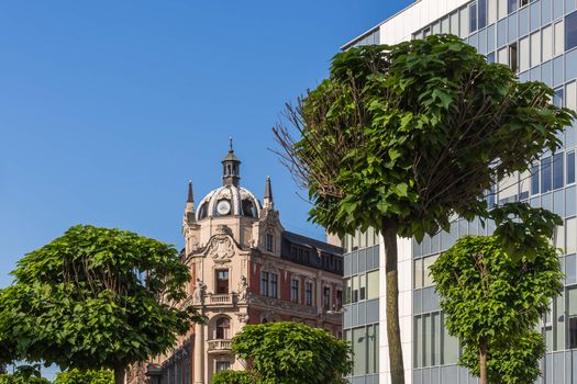 Main Market in Katowice, Poland. In the center tenement built in neo-baroque architectural style preceded by the trees.