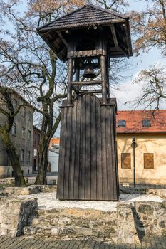 Ancient Miners Belfry in Tarnowskie Gory, Silesia region, Poland. Historic building dates back to sixteenth century, made of wood, stands on limestone base.