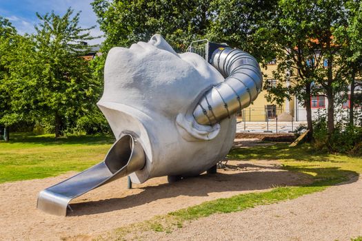 Remarkable slide for children in the shape of a human head located next to Naval Museum in Karlskrona.