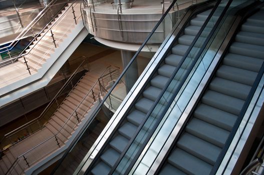 escalators and stairs in a modern office building