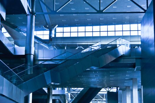 interior of the contemporary  business-center with escalators