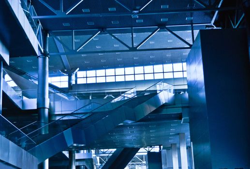 interior of the contemporary  business-center with escalators