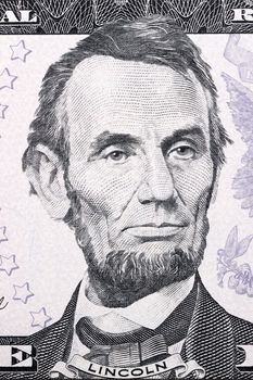 Portrait of Abraham Lincoln on five American dollars