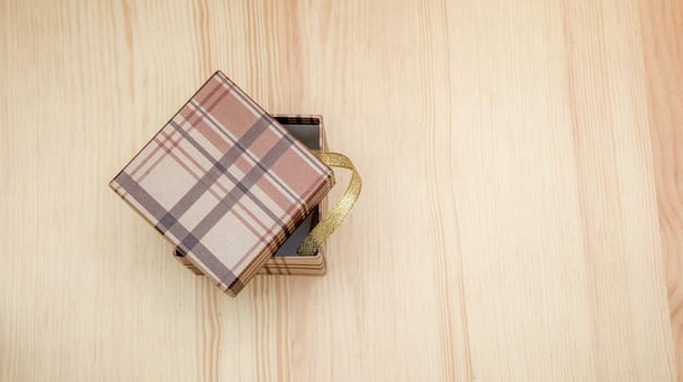 the gift box on a wooden table