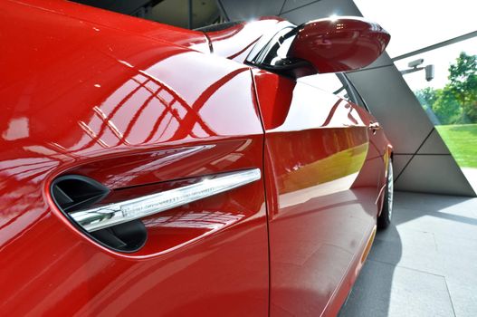 close-up of the side of red sports car
