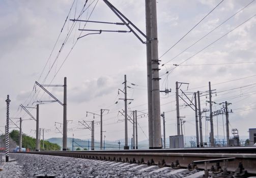 railroad track, embankment, and power poles