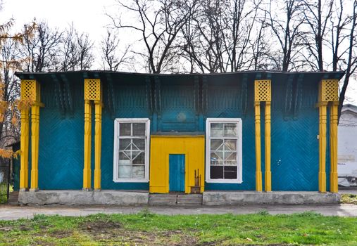 old abandoned wooden yellow blue building