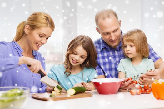 food, family, children, happiness and people concept - happy family with two kids making dinner at home