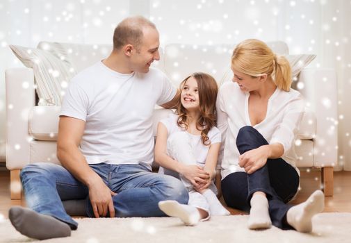 family, childhood, communication, people and home concept - smiling parents with little girl sitting on floor at home