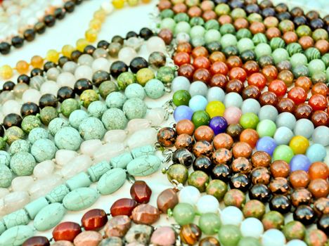 lots of colorful glass and stone beads  close up