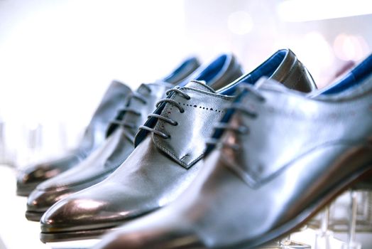 men's shoes on the shelves in the store