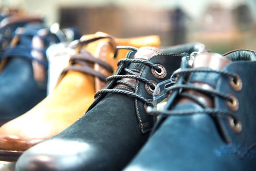 men's shoes on the shelves in the store