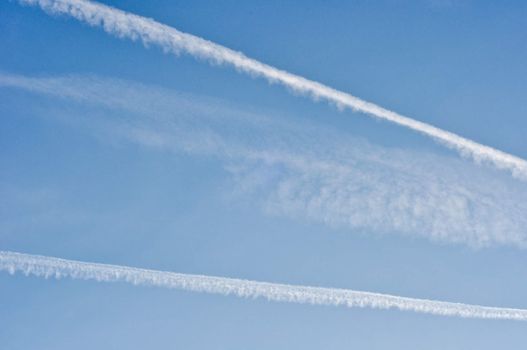 blue sky with traces of planes