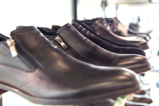 men's shoes on the shelves in the store