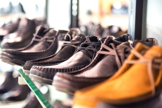 men's shoes on the shelves in the store