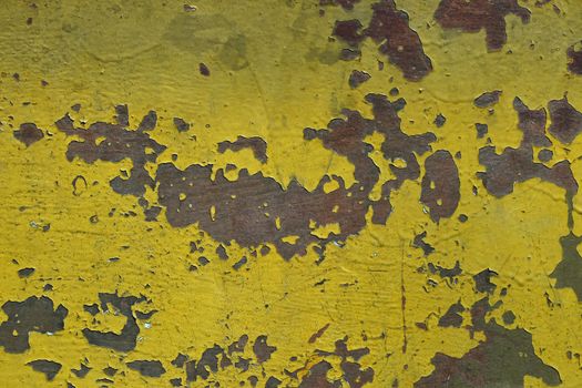 Stained corroded rusty yellow khaki painted metal surface with flakes and scratches