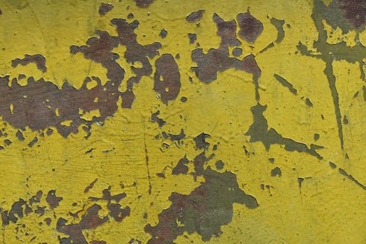 Stained corroded rusty yellow khaki painted metal surface with flakes and scratches