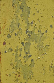 Stained corroded rusty yellow khaki painted metal surface with flakes and scratches