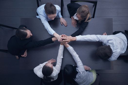 People with their hands together. Business team work concept