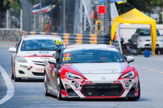 Bang Saen, Thailand - November 27, 2015: A Toyota 86 from Toyota Team Thailand leading a slower Toyota Vios at the 6 hour race street race during Bang Saen Speed Festival at Bang Saen, Chonburi, Thailand.