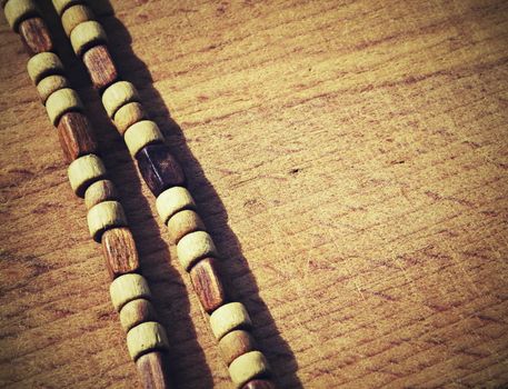 background retro wooden beads on old boards