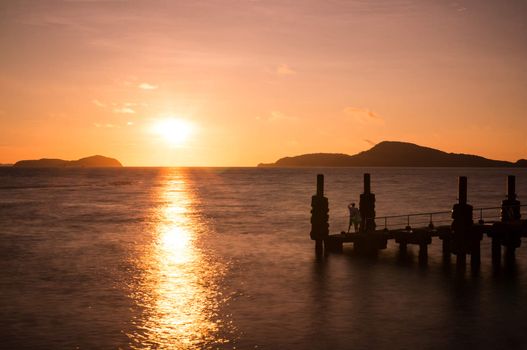 Rawai bridge before sunrise. Rawai Landing Pier was a famous place for seafood and also this bridge. On morning, many people joging and fishing. This also was a sunrise view point, you will see amazing sunrise here. Many tourist come here for seafood market.