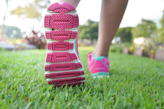 Woman walking on lawn