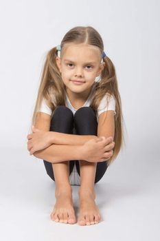six year old girl aspiring gymnast performs a number of training exercises