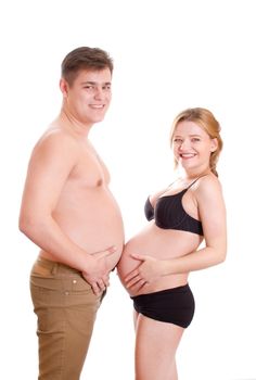 Pregnant woman and heavy man displaying their bare stomachs, caucasian/white.