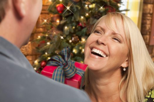 Attractive Girl Exchanging A Gift At A Christmas Party.