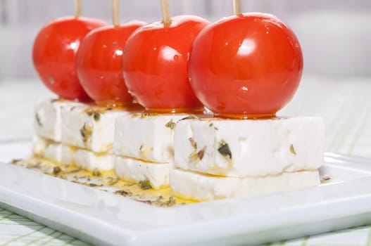 Cherry tomatoes with feta cheese, olive oil and oregano