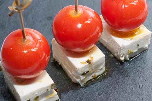 Cherry tomatoes with feta cheese, olive oil and oregano