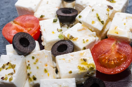 Feta cheese salad with black olives and cherry tomatoes