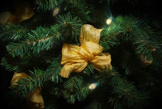 merry christmas tree golden garland ribbon decoration green fir closeup