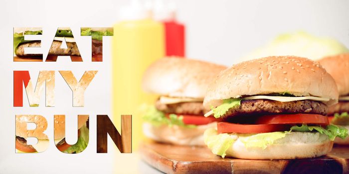 Hamburgers with cheese, potato chips and ingredients on a white background with typography