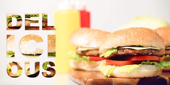 Hamburgers with cheese, potato chips and ingredients on a white background with typography