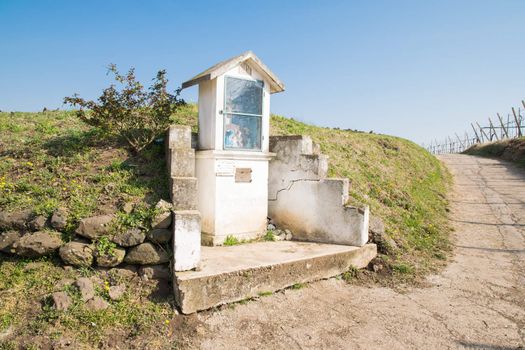 Italian traditional votive temple in the countryside dedicated to the holy family to propitiate the harvest