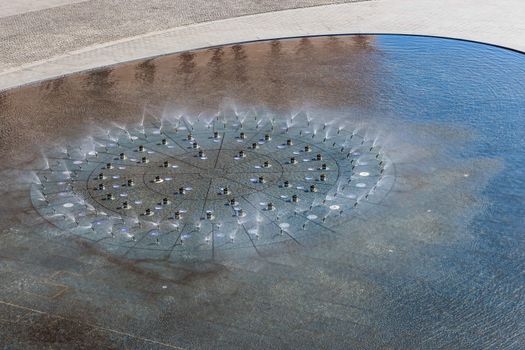 Idling water fountain viewed from above.