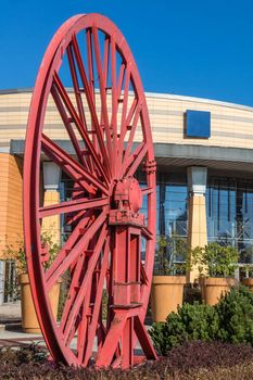 The old wheel  of a mine shaft in front of the "Silesia"  shopping mall and entertainment center  in Katowice, Poland. The  complex was built on the site of a former coal mine.