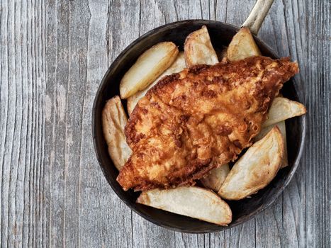 close up of rustic traditional english fish and chips